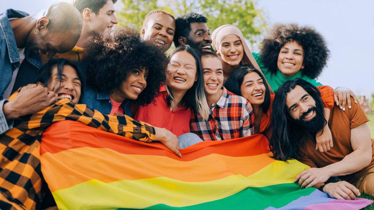 group of people with LGBTQ pride flag